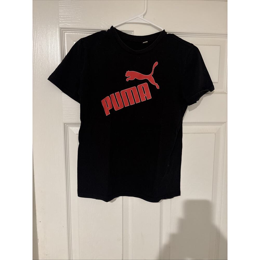 T Shirt. Black No Size Is Listed On The Shirt. Most Likely Size 10 (A23)